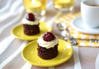 Chocolate cakes with buttercream and cherries