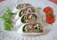 Tortilla rolls with grilled vegetables, olive tapenade and goat’s cheese
